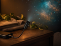 Whale Drift Projector casting a galaxy on the bedroom wall
